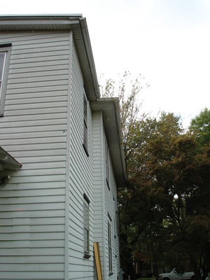 
Install a new leader from the gutter on the side of the house to ensure that stormwater is directed away from the foundation wall.
